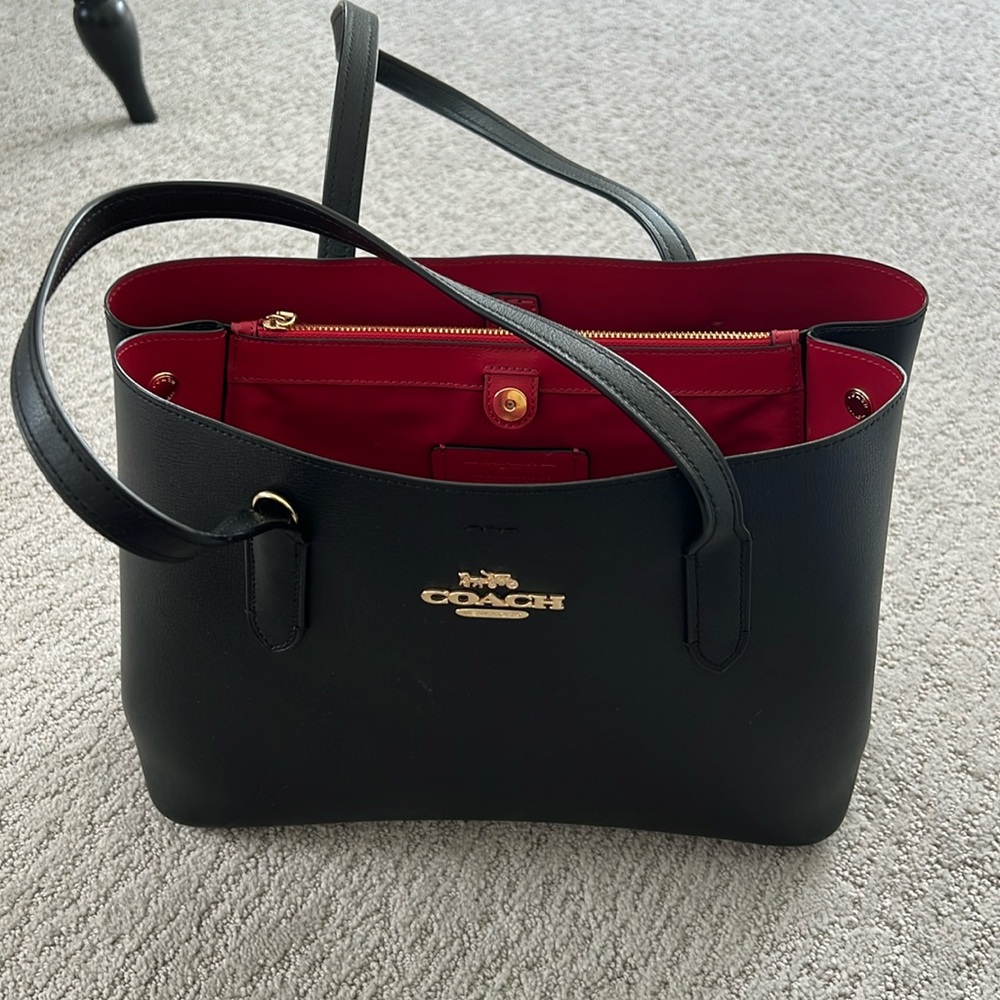 Black coach tote with red interior